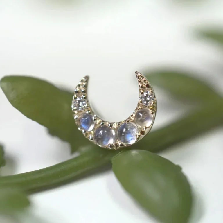 diamond moon shaped piece of jewelry crafted by modern mood jewelry