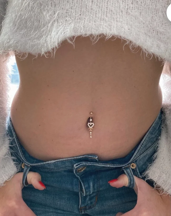 a person with a piercing on their belly